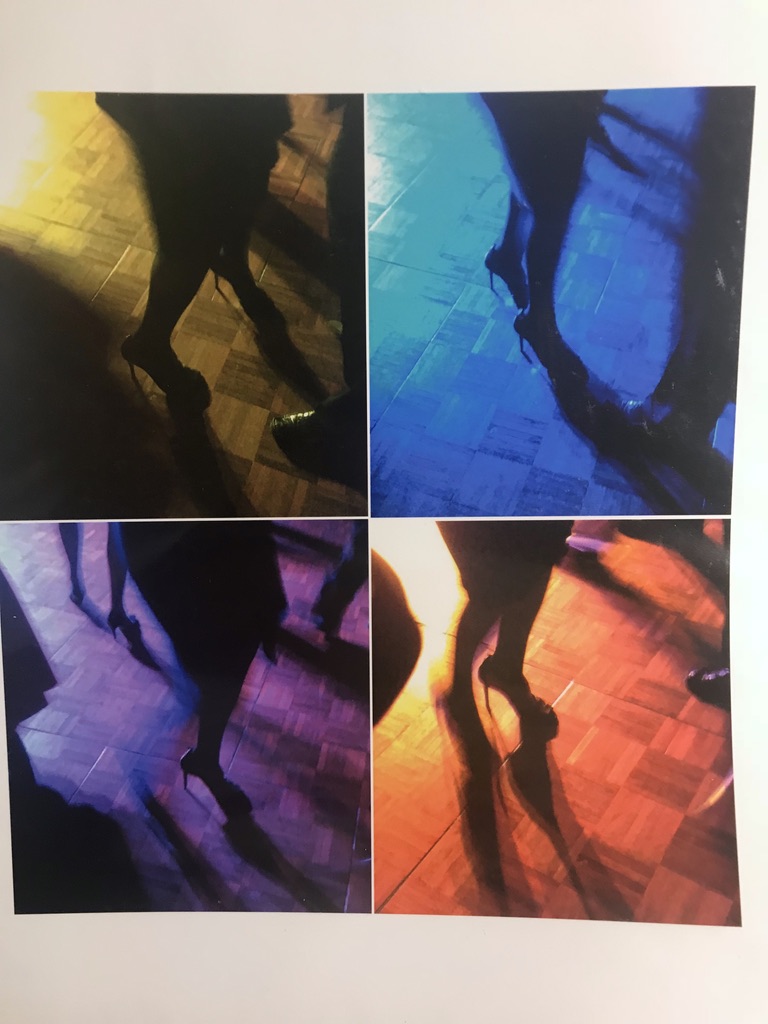 Ladies' feet in motion are floating across the floor, illuminated by flashing disco lights echoing the vibrations in the music.